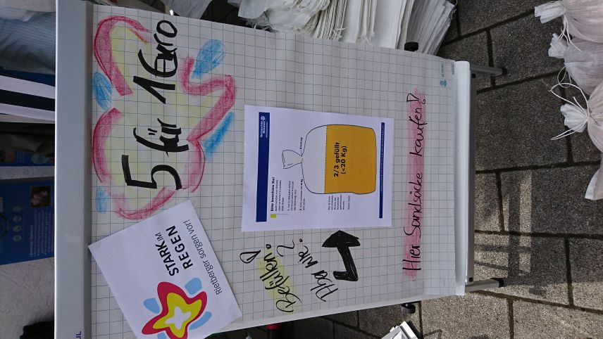 Foto von Verkaufstafel für Sandsäcke